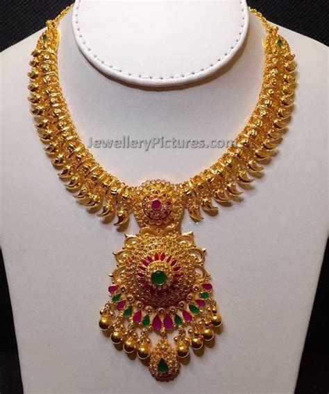 Heavy mango haram in 22 carat gold with small gold beads embedded in the chain, studded with uncut diamonds, emerald and ruby drop, paire. Mango Jewelry Traditional Designs - Jewellery Designs