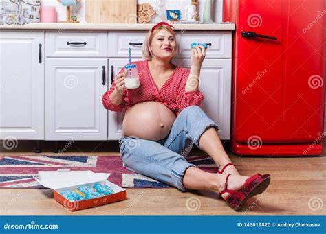 Pregnancy And Unhealthy Eating Concept Pregnant Woman Eats A Tasty