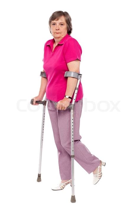 Unhappy Handicapped Woman With Crutches Stock Photo Colourbox