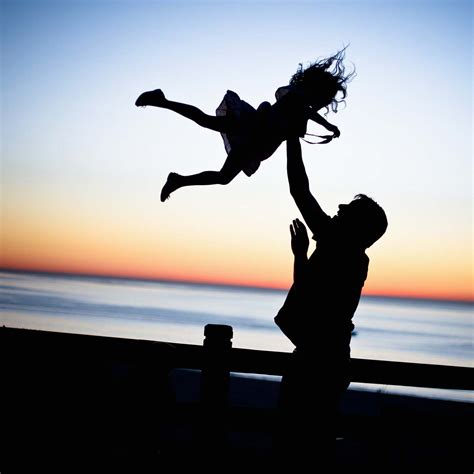 Leisure Activities Silhouette Of Man Throwing Girl In Air Dance Pose