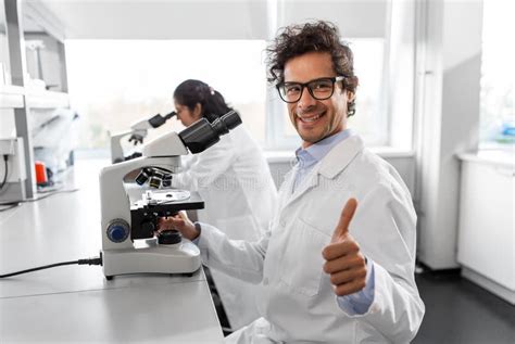 Scientist With Microscope Working In Laboratory Stock Image Image Of