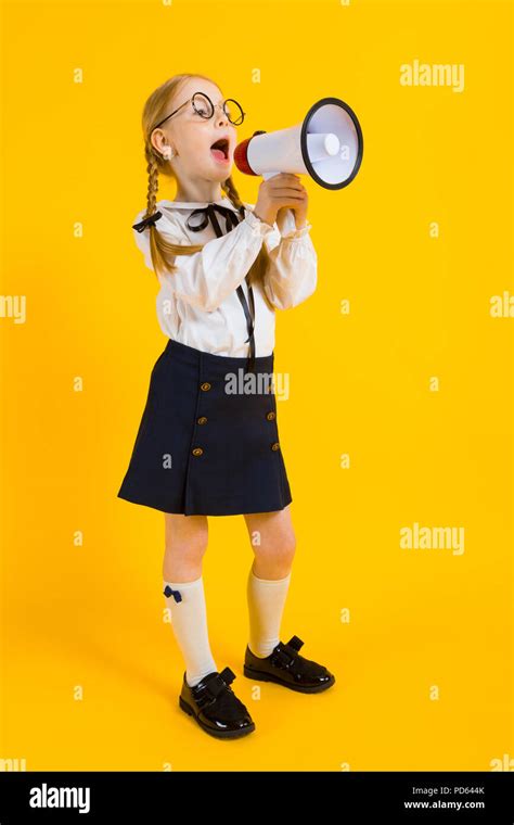 Girl With Red Pigtails On A Yellow Background A Charming Girl In Round