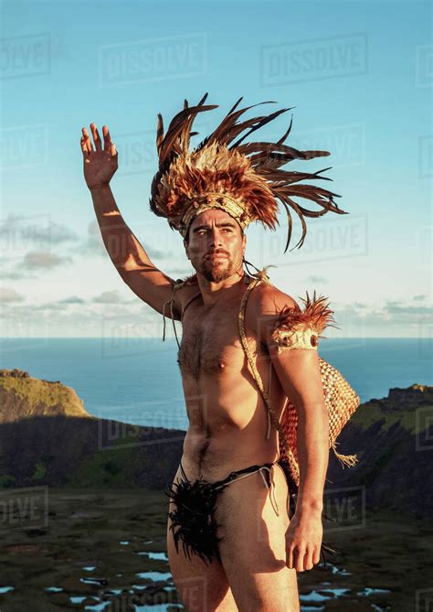 Native Rapa Nui Man In Tradititional Costume On The Rim Of The Rano Kau Volcano Easter Island