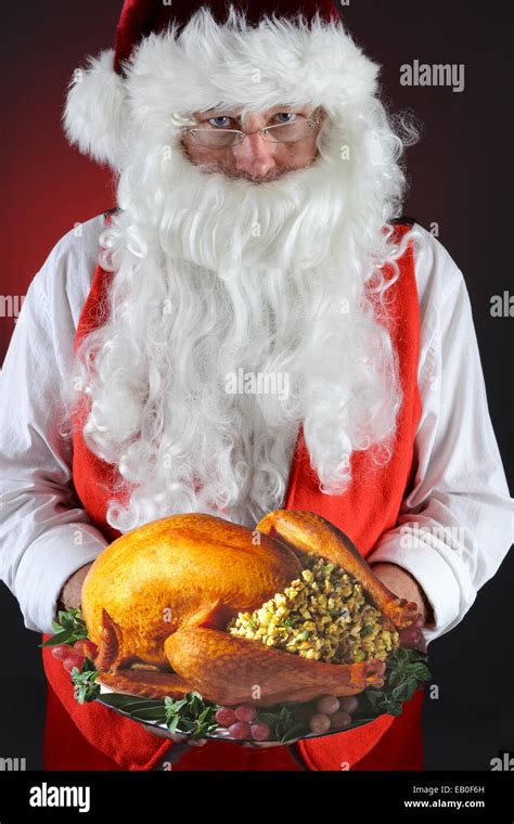 Santa Claus Serving A Fresh Roasted Thanksgiving Or Christmas Turkey