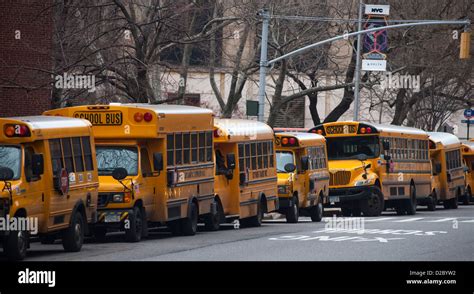 School Buses Parked Outside Of An Elementary School In The New York