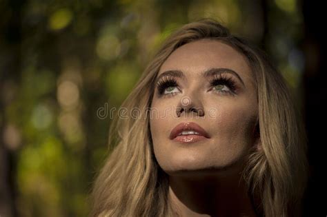 a lovely blonde model poses outdoors in a forrest environment stock image image of environment
