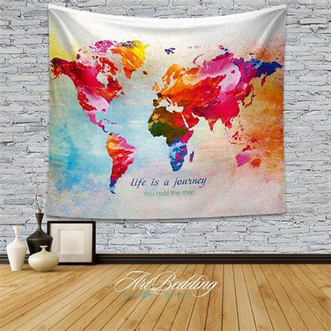 A Colorful World Map Tapestry Hanging On A Brick Wall