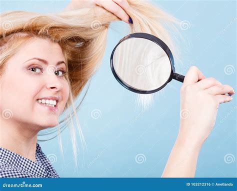 Woman Looking At Hair Through Magnifying Glass Stock Photo Image Of