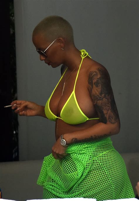 Amber Rose Shows Off Her Big Boobs And Ass Wearing A See Through Yellow