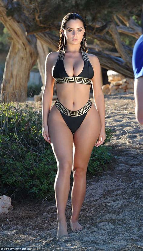 Demi Rose Flaunts Her Sensational Curves In A Plunging Black And Gold Bikini Daily Mail Online