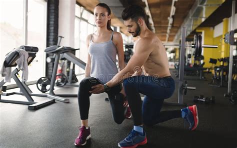 Personal Trainer Assisting Woman Lose Weight Stock Photo Image Of