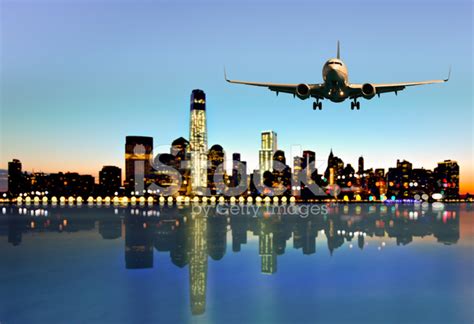 Airplane Fly Above The City Stock Photos