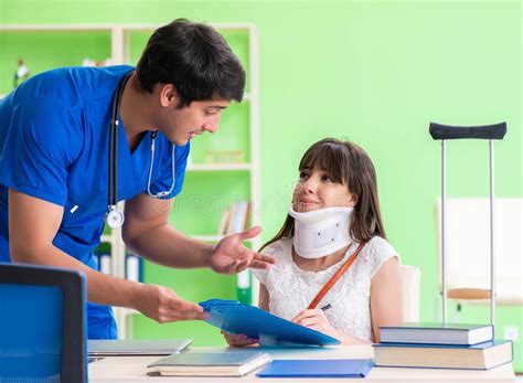 Female Patient Visiting Male Doctor In Medical Concept Stock Photo