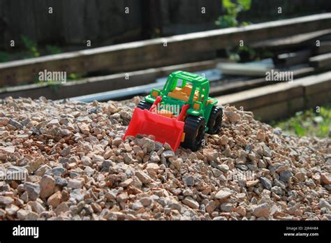 Toy Tractor On A Pile Of Rubble Kids Game Stock Photo Alamy
