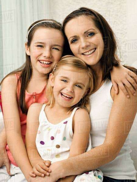 A Portrait Of A Mother And Two Babes Stock Photo Dissolve