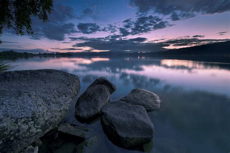 Boulders On Body Of Water Surrounded By Trees Under Stratus Clouds Hd