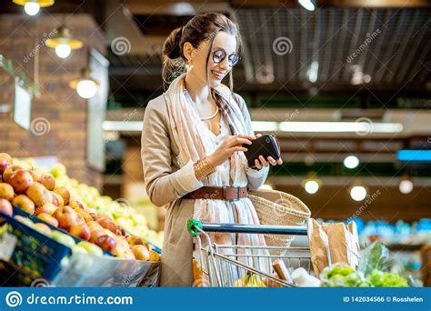 Woman Buying Food In The Supermarket Stock Photo - Image of market ...