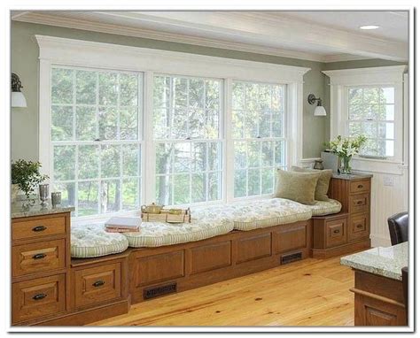 In the master bedroom of a new orleans home by peter rogers, an antique leather bench contrasts with the white wooden bed. under window storage bench bedroom remarkable under window ...