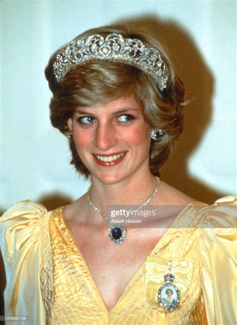 Diana Princess Of Wales Wearing A Yellow Satin Ballgown Designed By