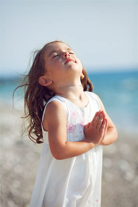 Cute Little Girl Praying Stocksy United