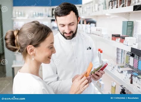 Pharmacist With Client In The Pharmacy Store Stock Photo Image Of