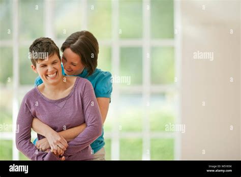Mid Adult Couple Bonding In Their New Home Stock Photo Alamy