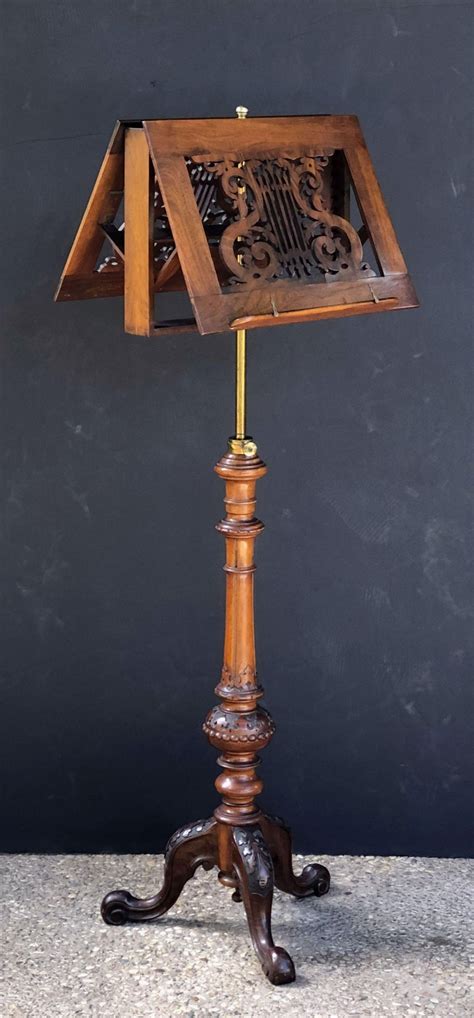 Antique and stunning stand for sheet music or books. English Adjustable Duet Music Stand of Carved Walnut For Sale at 1stdibs