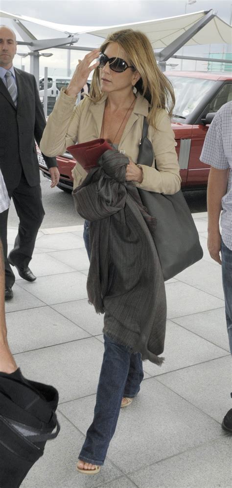 Jennifer Aniston At London Heathrow Airport Heading Back To La