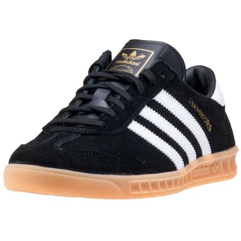 Stylized as adidas since 1949) is a german multinational corporation, founded and headquartered in herzogenaurach, germany, that designs and manufactures shoes, clothing and accessories. adidas Hamburg Mens Trainers in Black Gum