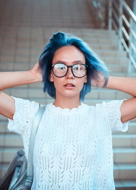 Premium Photo Close Up Portrait Of A Hipster Girl Wearing Glasses With Blue Hair Atypical