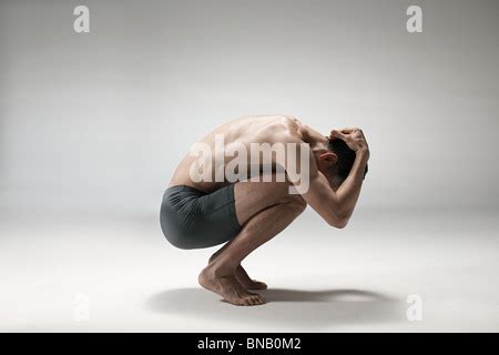 Man Crouching Down Stock Photo Alamy