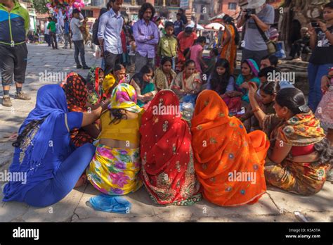 kathmandu nepal 9 26 2015 a group of hindu women in traditional sari sit at durbar square in