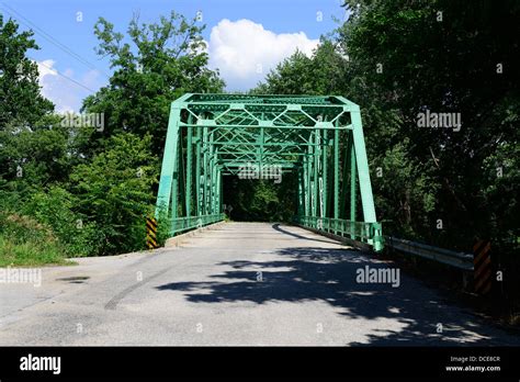 Old Steel Howe Truss Style Bridge Over A River In Central Indiana Stock