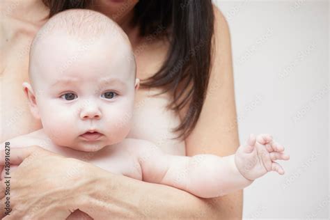 Naked Mother Carrying Naked Baby In Arms Photos Adobe Stock