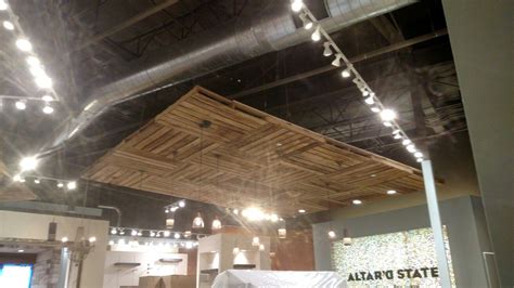 Sometimes height comes into play when choosing a good ceiling material. Pallet floating ceiling in a boutique | Floating ceiling ...