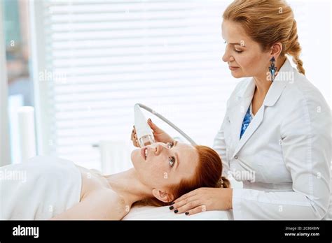 Professional Cosmetologist Doing Anti Wrinkle Facial Treatment Concept Of Skin Care And