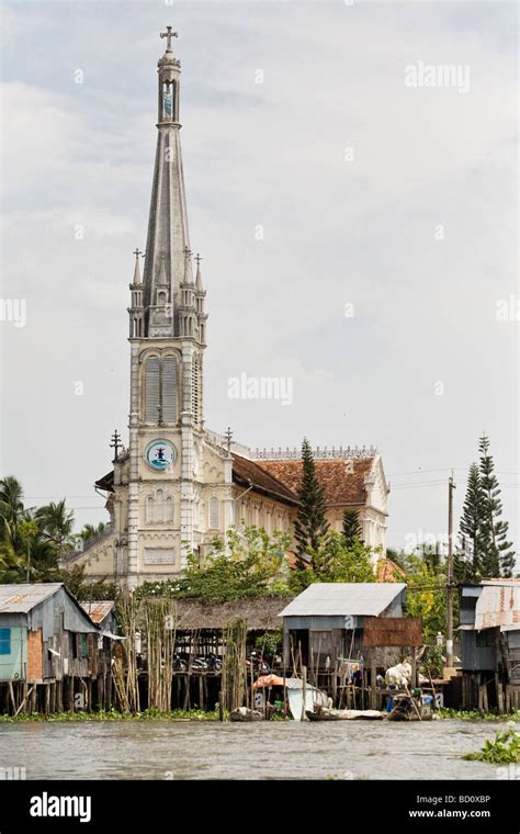 A Church Behind A Floating Village In The Mekong Delta Vietnam Stock