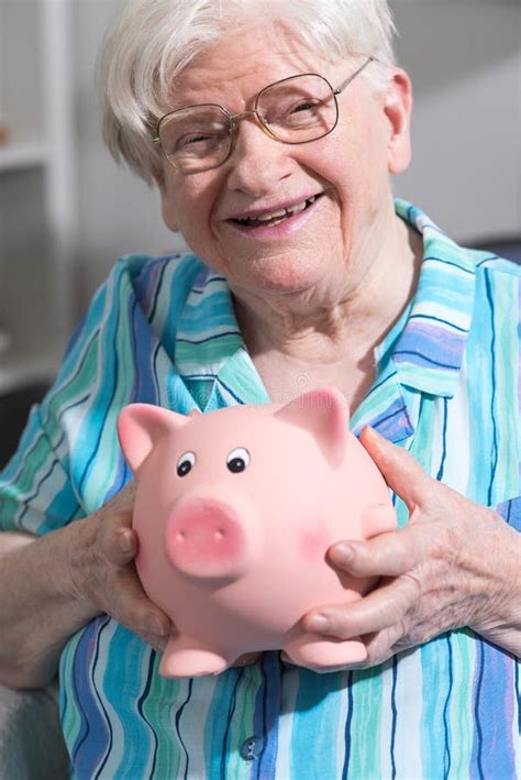Old Woman Holding A Piggy Bank Stock Image Image Of Female Holding