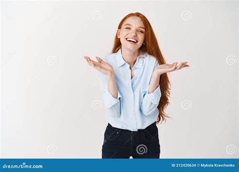 Image Of Beautiful Young Woman With Natural Red Hair Laughing Spread Hands Sideways Clueless