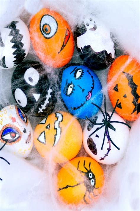 An Assortment Of Painted Rocks In The Snow With Faces On Them And Eyes