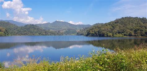 Landscape View Of Lake Or River With Reflection Green Mountain And