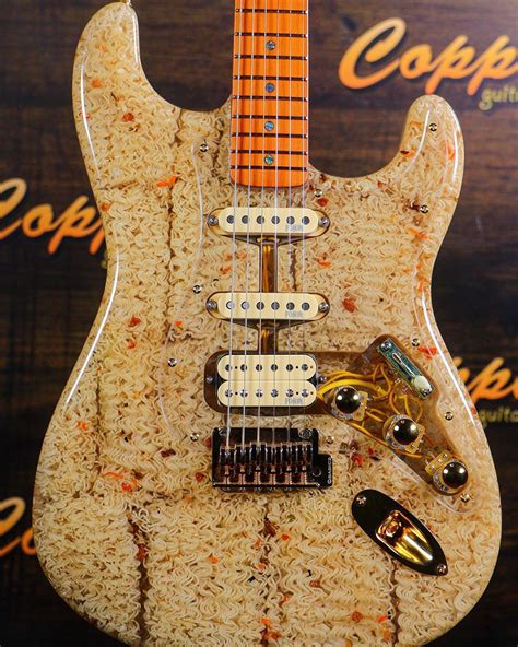 Ramen noodles are easy to make but the dough is tough to knead and roll by hand. Someone Built a Guitar from Ramen Noodles