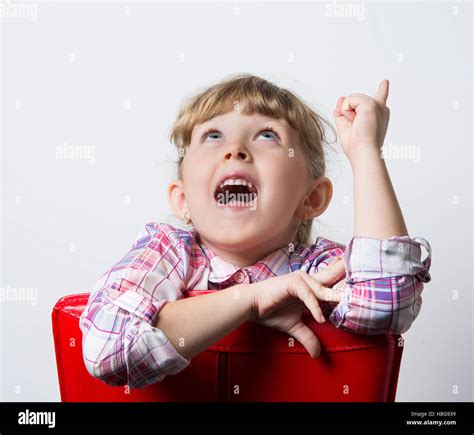 Little Funny Girl With Red Chair Stock Photo Alamy