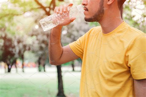 Man Drinking Water After Exercise Stock Photo Containing Water And
