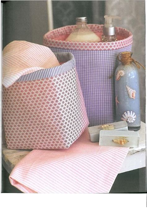 Some Pink And White Baskets Sitting On Top Of A Table