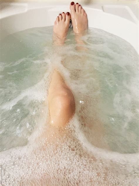 Woman S Naked Legs In Bathtub Full Of Bubbly Water By Stocksy Contributor Holly Clark Stocksy