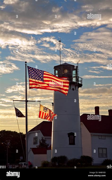 Chatham Coast Guard Lighthouse With American Flag At Sunsetlate Eveing