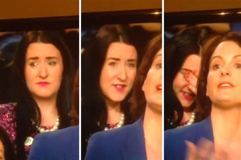 Facepalm Lady Who Mouths Insult Behind Speakers Back During Debate