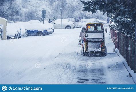 Snow Plow Truck Clearing Road After Winter Snowstorm Blizzard For Car