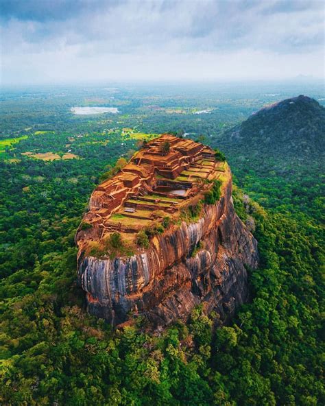 sigiriya fortress rising from the jungle canopies of sri lanka s central province 🇱🇰 this